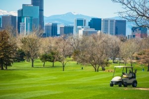 Manicured Golf course with view of the Denver Skyline