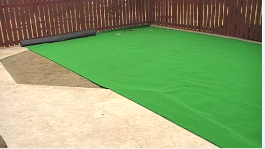 rolling out the artificial turf